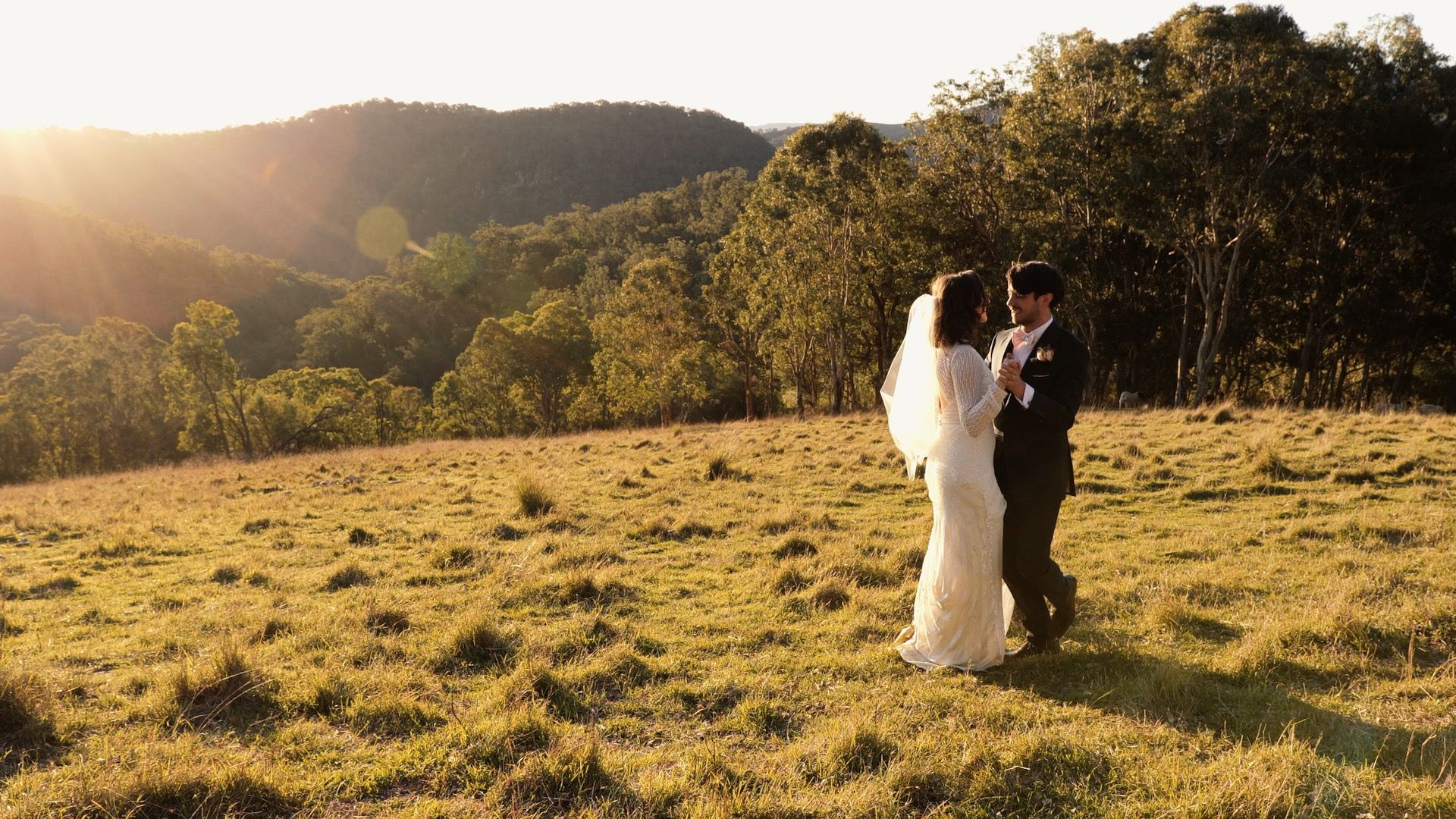 Newlyweds hugging and posing for a photo - raw footage wedding videography services in the Blue Mountains and surrounding areas - Just Footage
